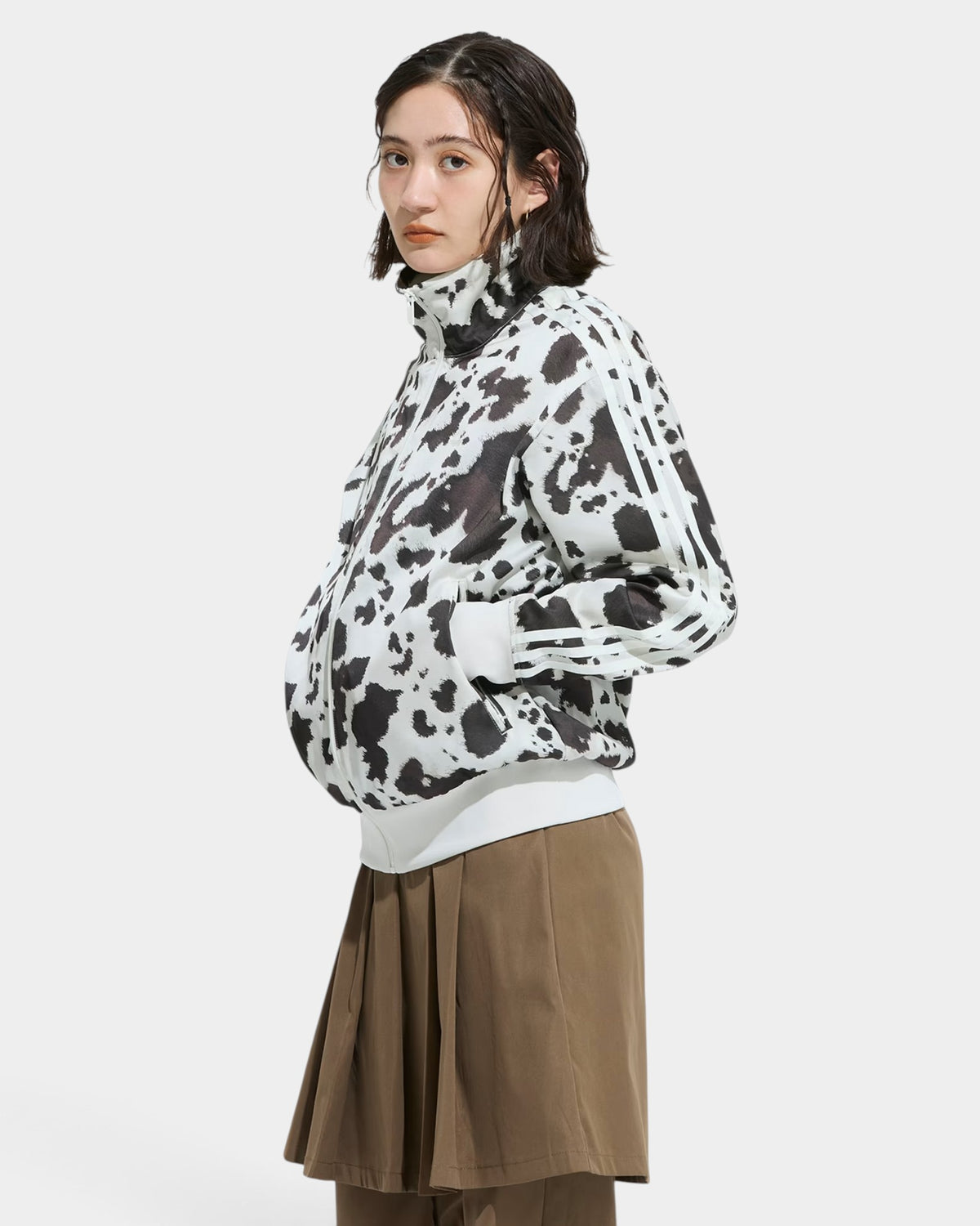 Lockwood Avenue adidas satin track top featuring a black and white animal print, stand-up collar, and 3-Stripes sleeves.