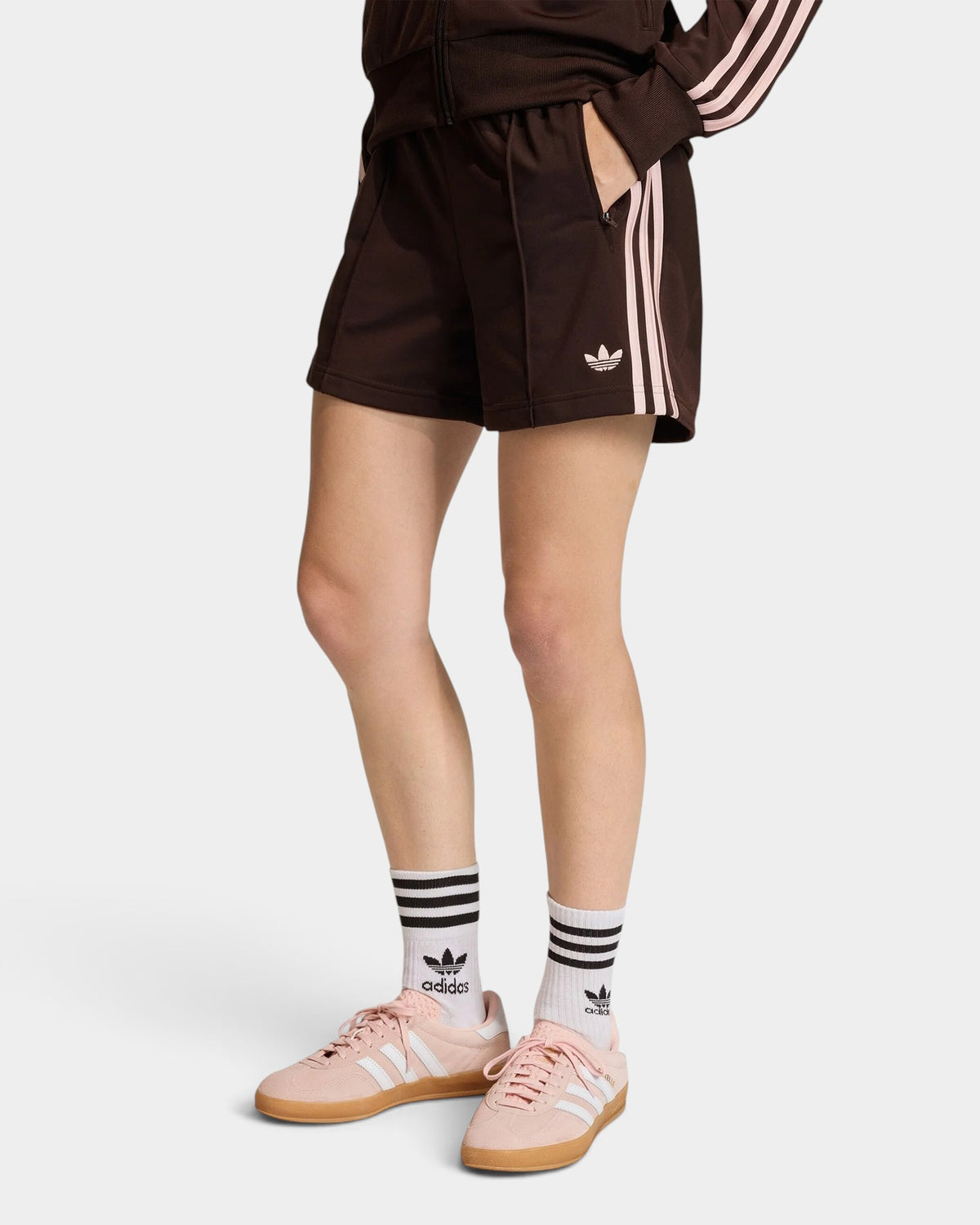 Lockwood Avenue adidas Firebird brown tricot shorts with side 3-Stripes and embroidered logo on a model