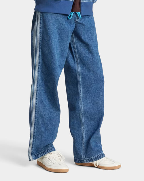 Lockwood Avenue adidas Adicolor Denim Firebird pants in blue cotton with iconic white 3-Stripes down the sides.