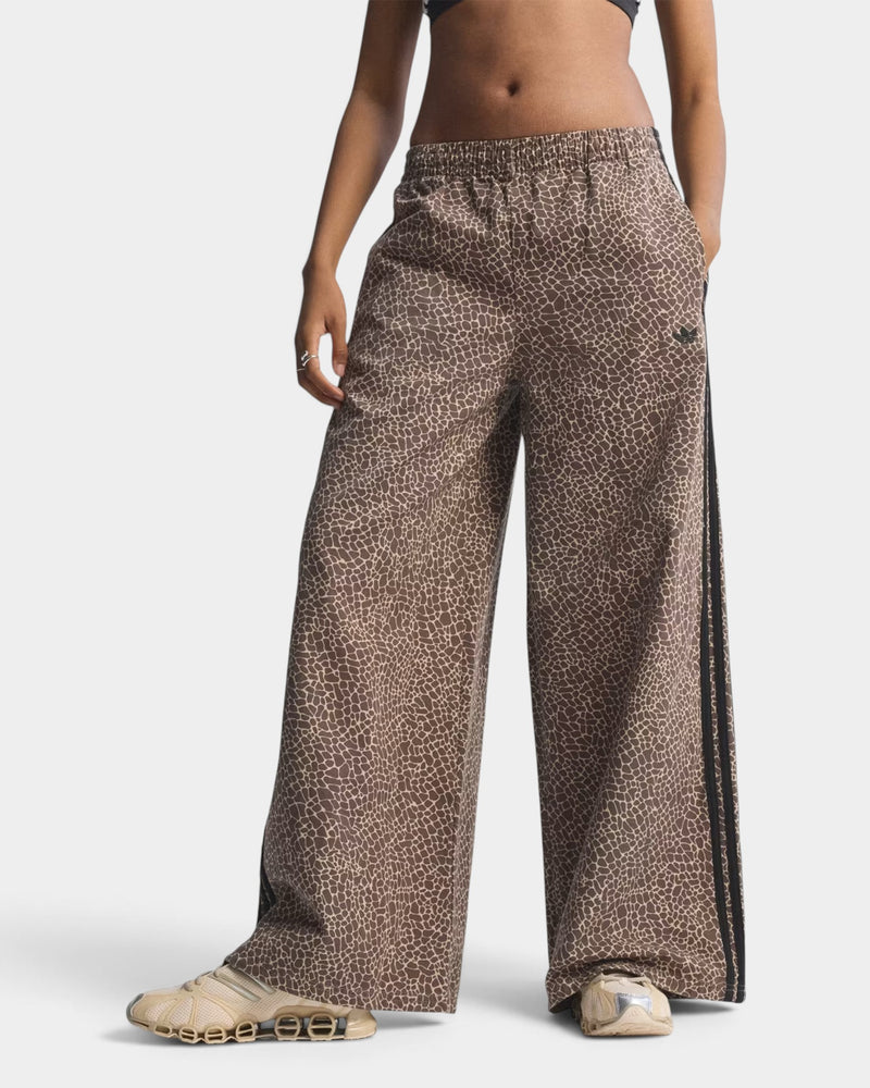 Lockwood Avenue adidas Firebird oversized denim pants in brown animal print with black side stripes and elastic waist