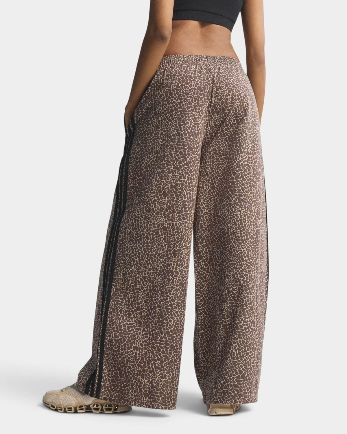 Lockwood Avenue adidas Firebird oversized denim pants in brown animal print with black side stripes and elastic waist