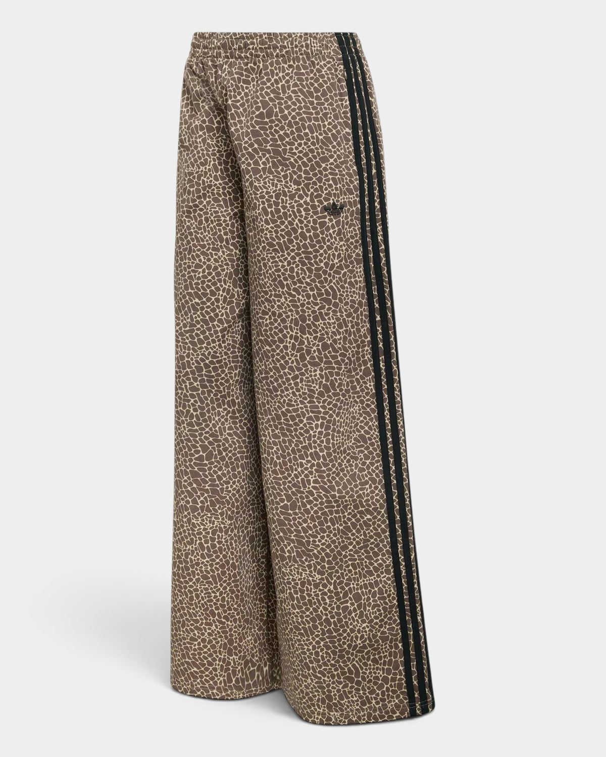 Lockwood Avenue adidas Firebird oversized brown denim pants with all-over animal print and black side stripes.