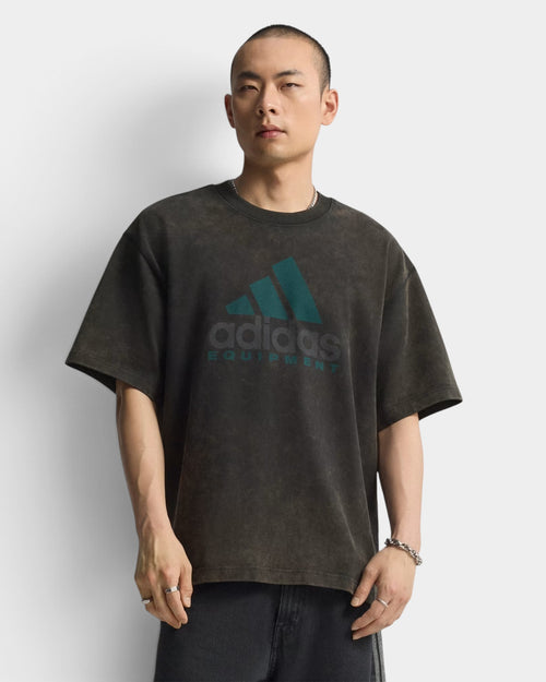 Lockwood Avenue model wearing an oversized black cotton adidas Equipment t-shirt with a vintage-style graphic print.