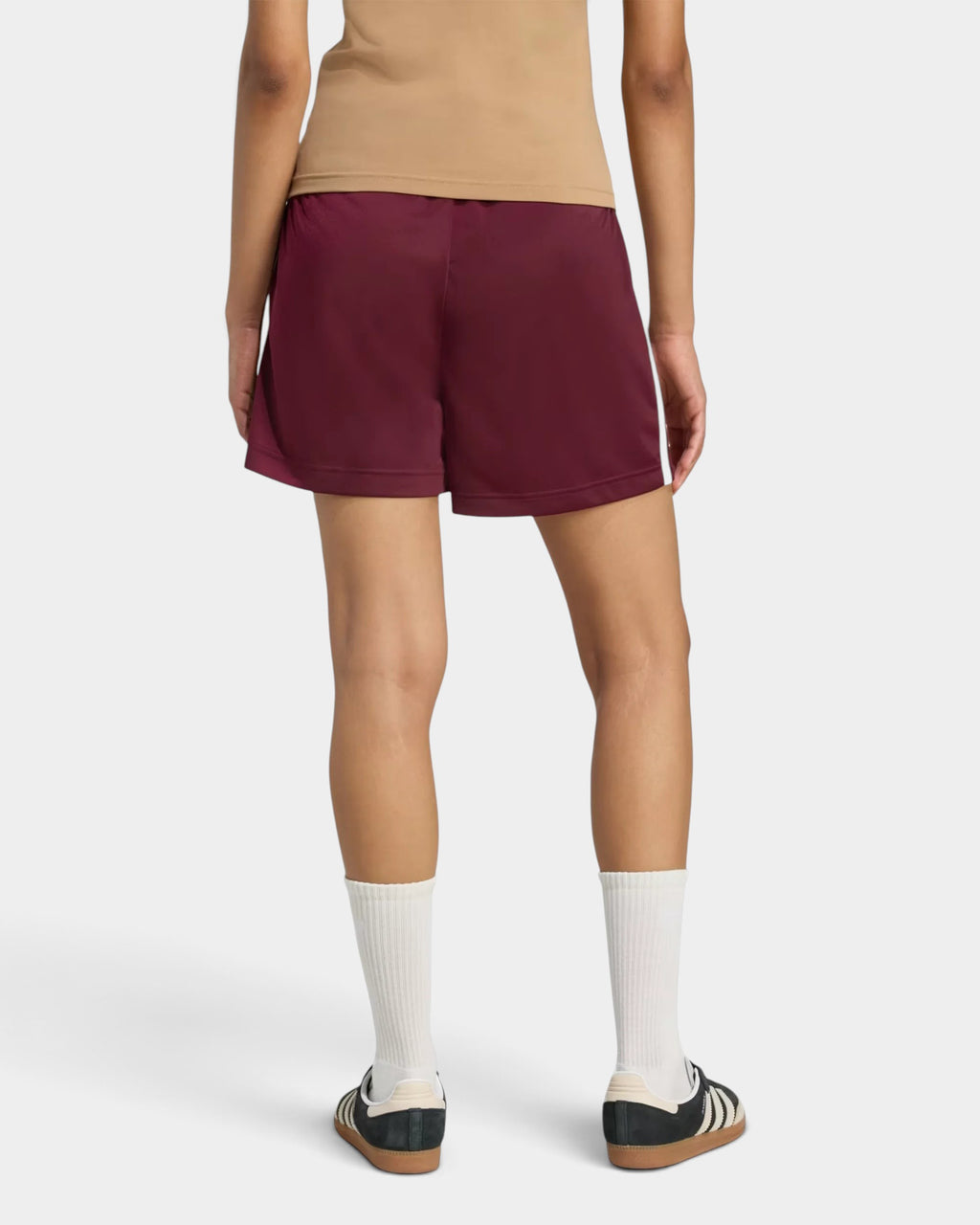 Lockwood Avenue adidas Firebird maroon tricot shorts with elastic waist and side zip pockets, back view on model.