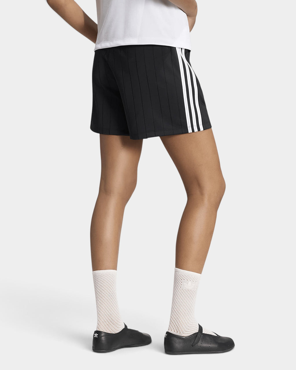 Lockwood Avenue model wearing adidas Pinstripe Sprinter Shorts in Black, back view with white 3-Stripes on the side