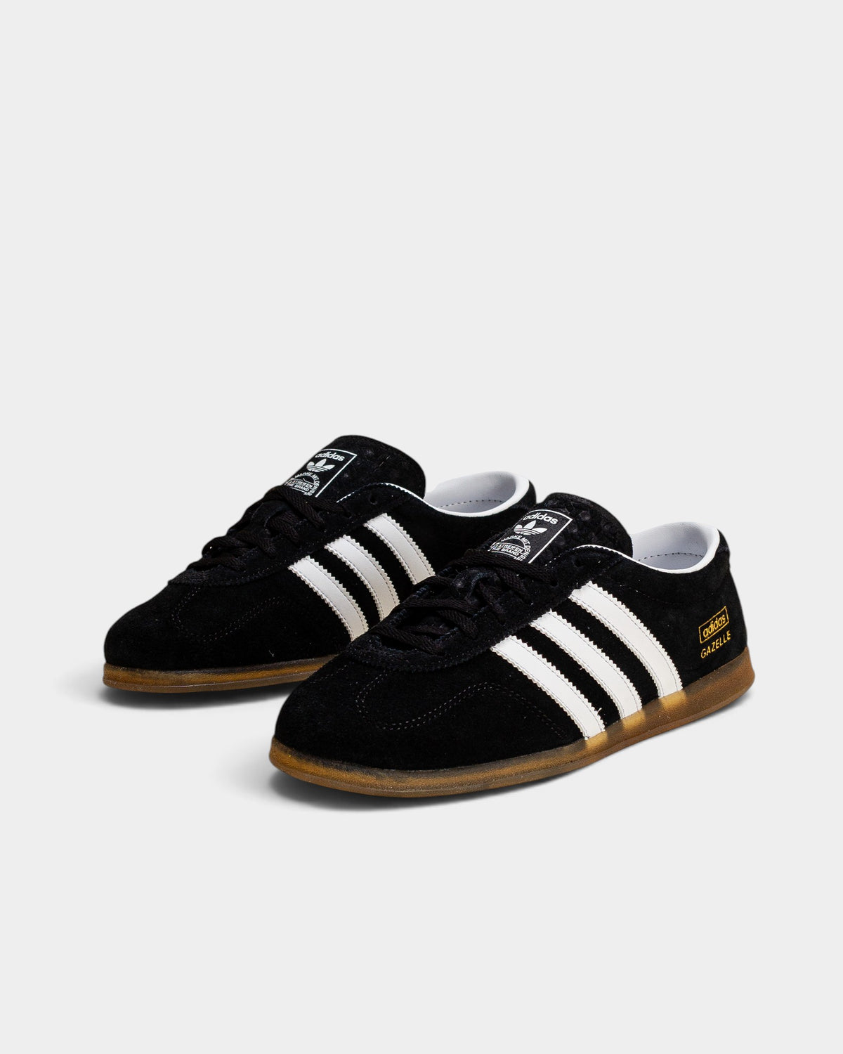 Lockwood Avenue adidas Gazelle Lo Pro W black leather sneakers with white stripes and low-profile gum outsoles.