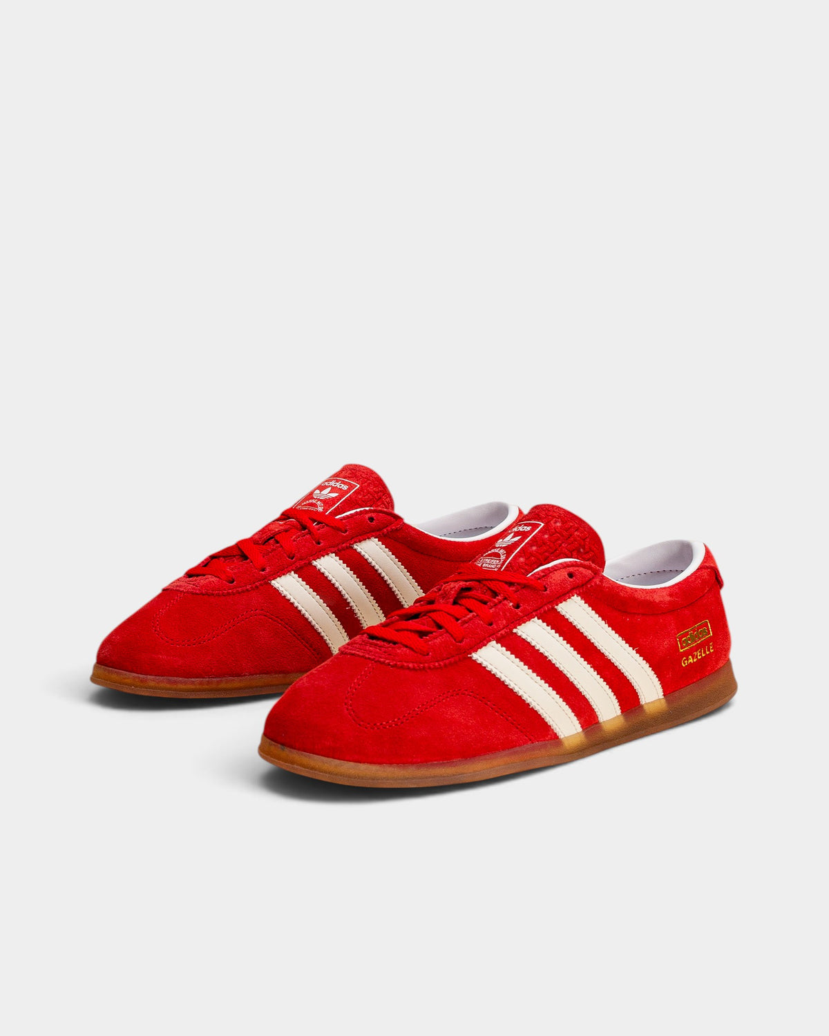 Lockwood Avenue adidas Gazelle Lo Pro women's scarlet suede sneakers with white 3-Stripes and slim gum outsoles.