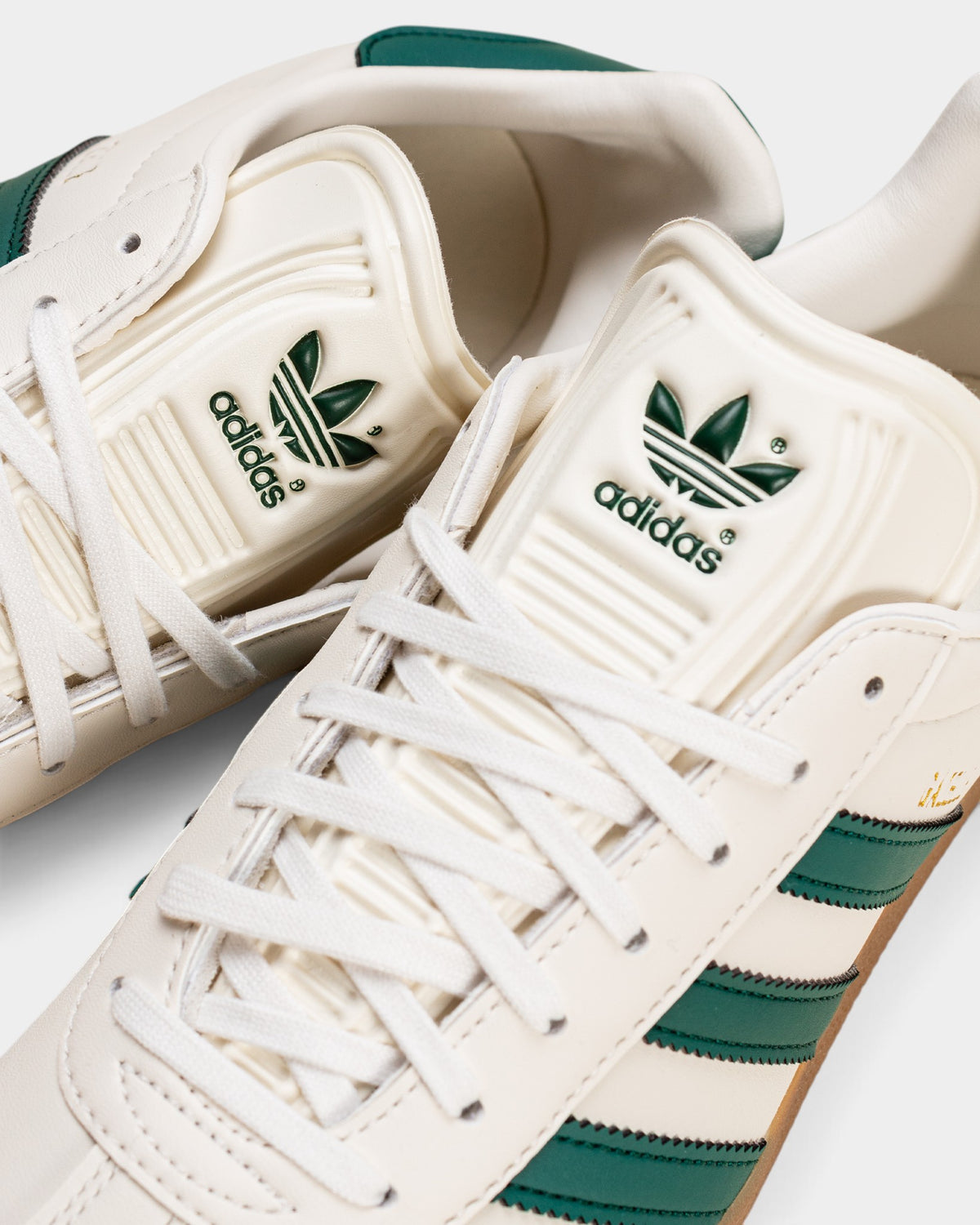 Lockwood Avenue adidas Gazelle sneakers in cloud white suede with core green stripes and branded tongue detail