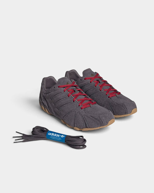 Lockwood Avenue adidas Ghost Sprint women's grey suede sneakers with red laces and low-profile gum rubber outsoles.