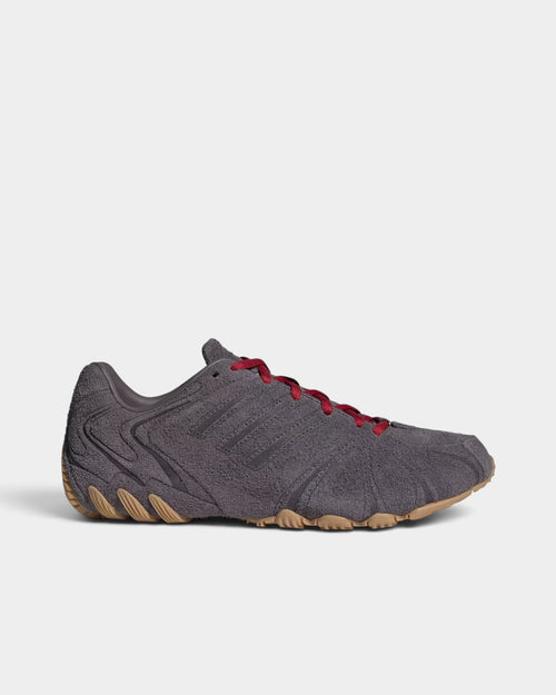 Lockwood Avenue adidas Ghost Sprint women's grey suede sneakers with red laces and a low-profile gum rubber outsole.
