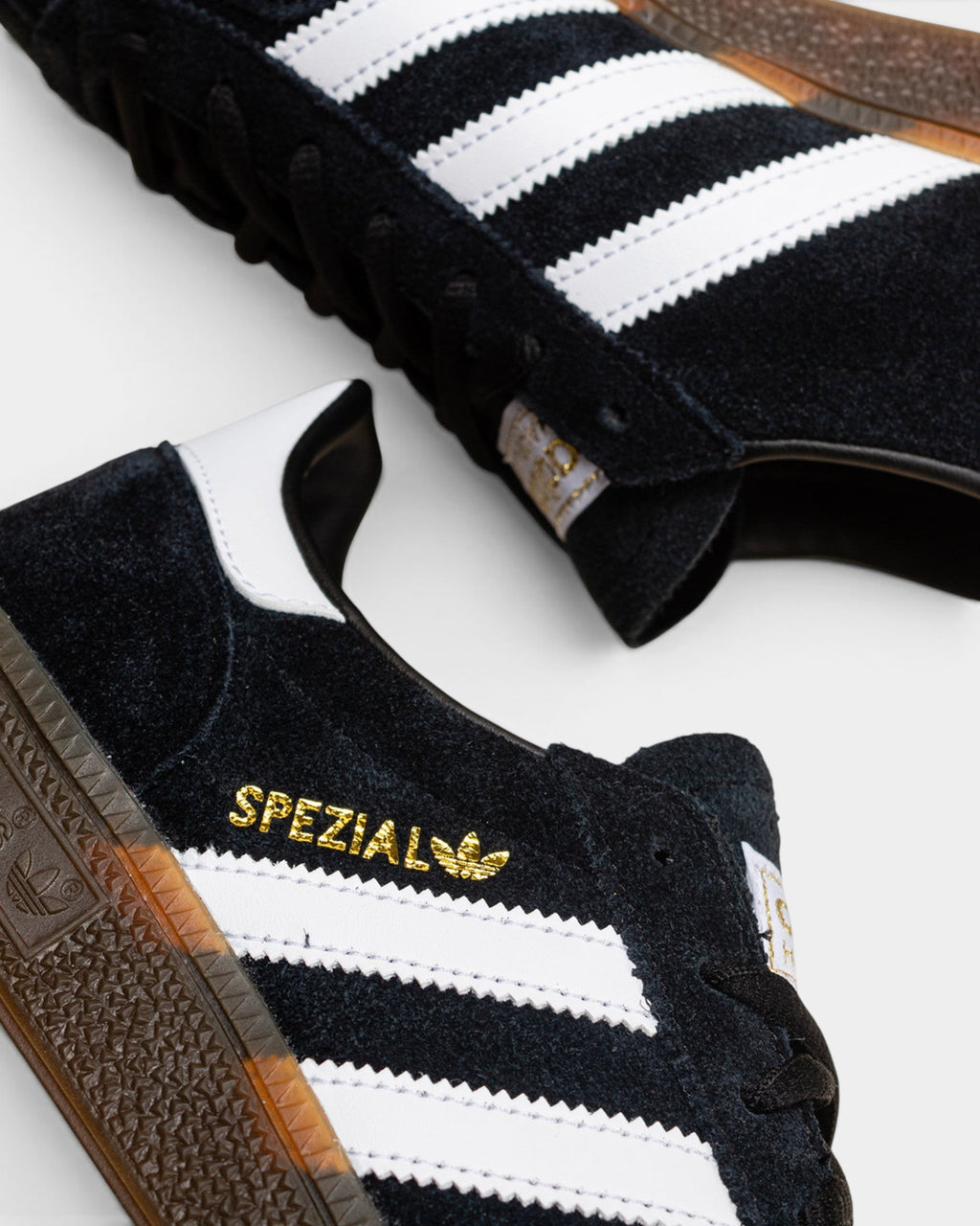 Lockwood Avenue adidas Handball Spezial black suede sneakers with white stripes, gold branding, and gum rubber sole.