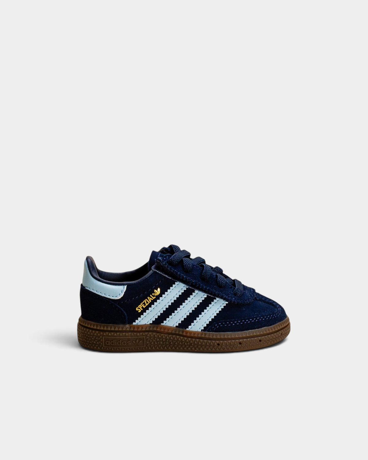 Lockwood Avenue adidas Handball Spezial kids shoes in navy suede with light blue stripes and a gum rubber sole.
