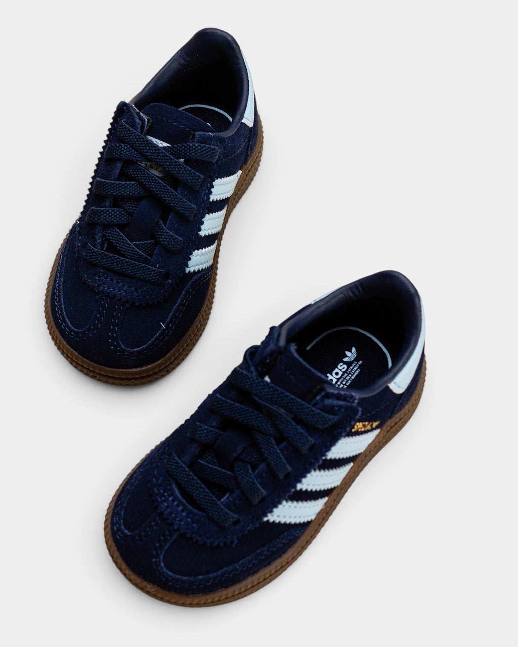 Lockwood Avenue adidas Handball Spezial kids shoes in collegiate navy suede with clear sky accents and gum sole.