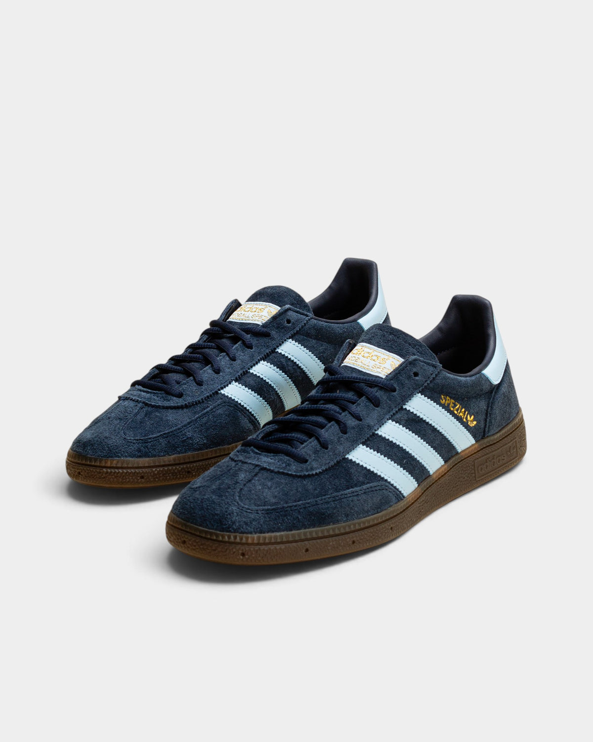 Lockwood Avenue adidas Handball Spezial navy suede sneakers with light blue leather stripes and a gum rubber sole.