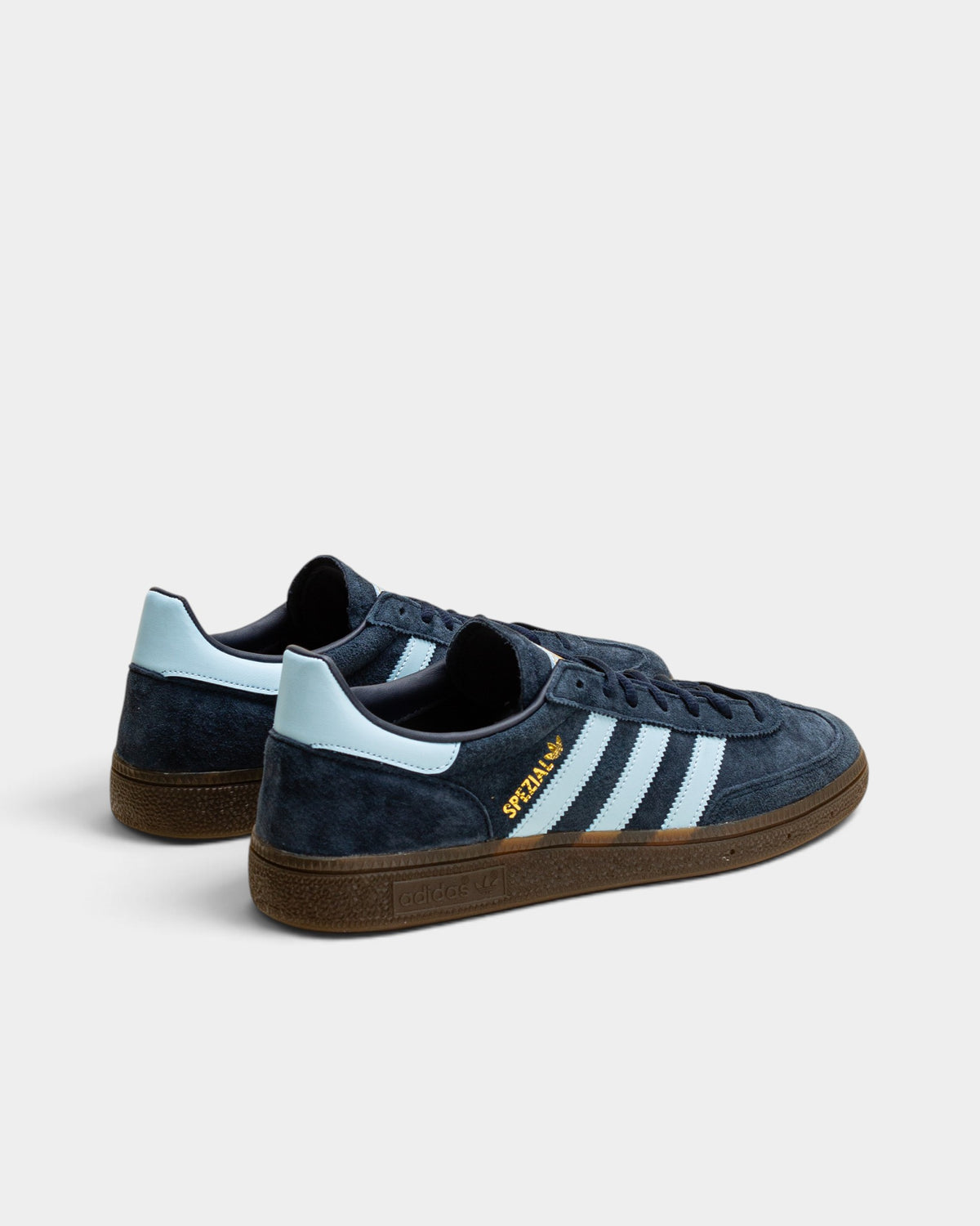 Lockwood Avenue adidas Handball Spezial navy suede sneakers with light blue stripes and a gum rubber sole.