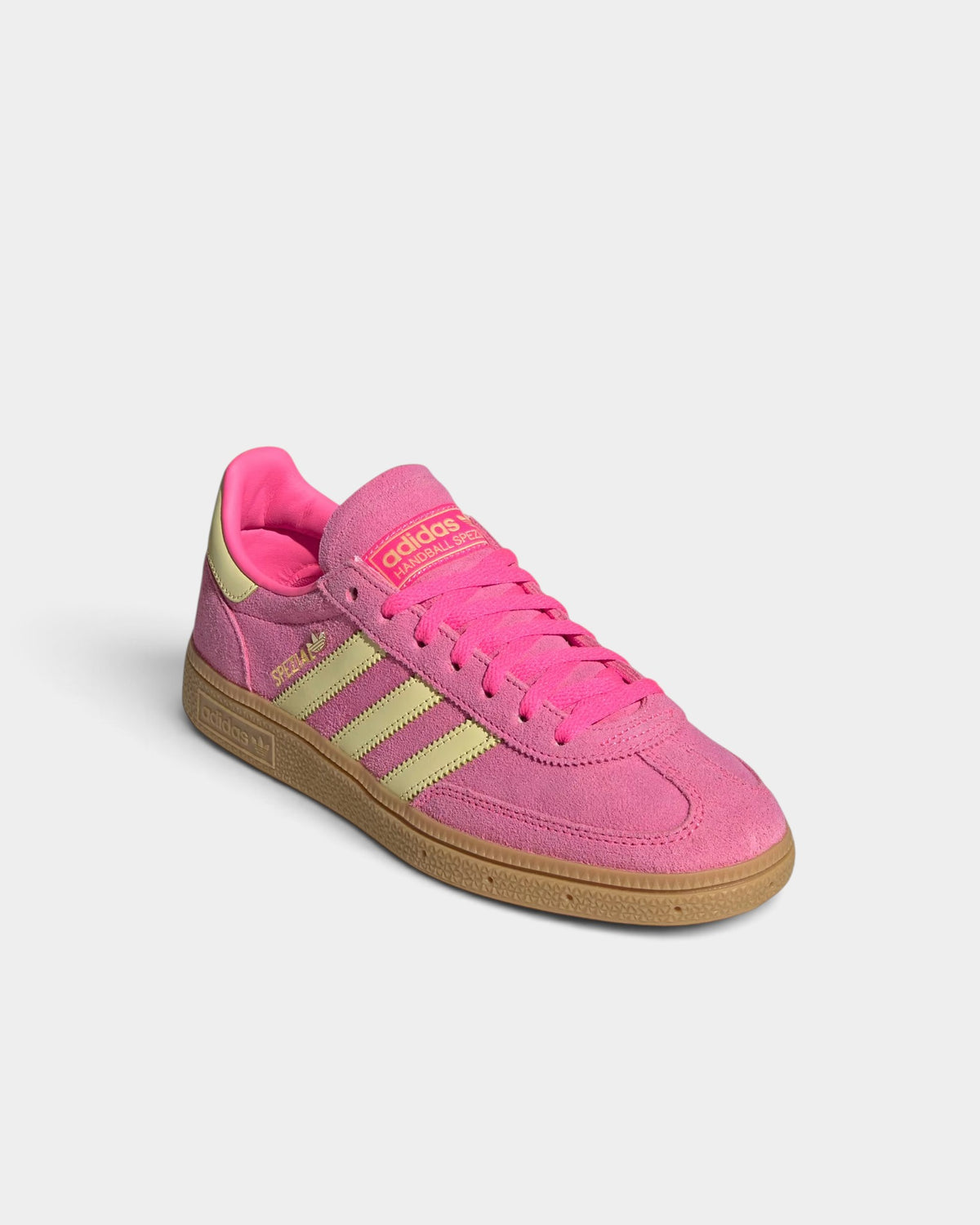 Lockwood Avenue adidas Handball Spezial suede sneakers in lucid pink with yellow stripes and a gum rubber sole.