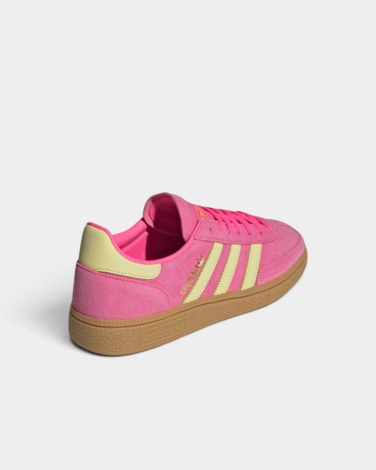 Lockwood Avenue adidas Handball Spezial shoes in lucid pink suede with yellow stripes and a classic gum sole.