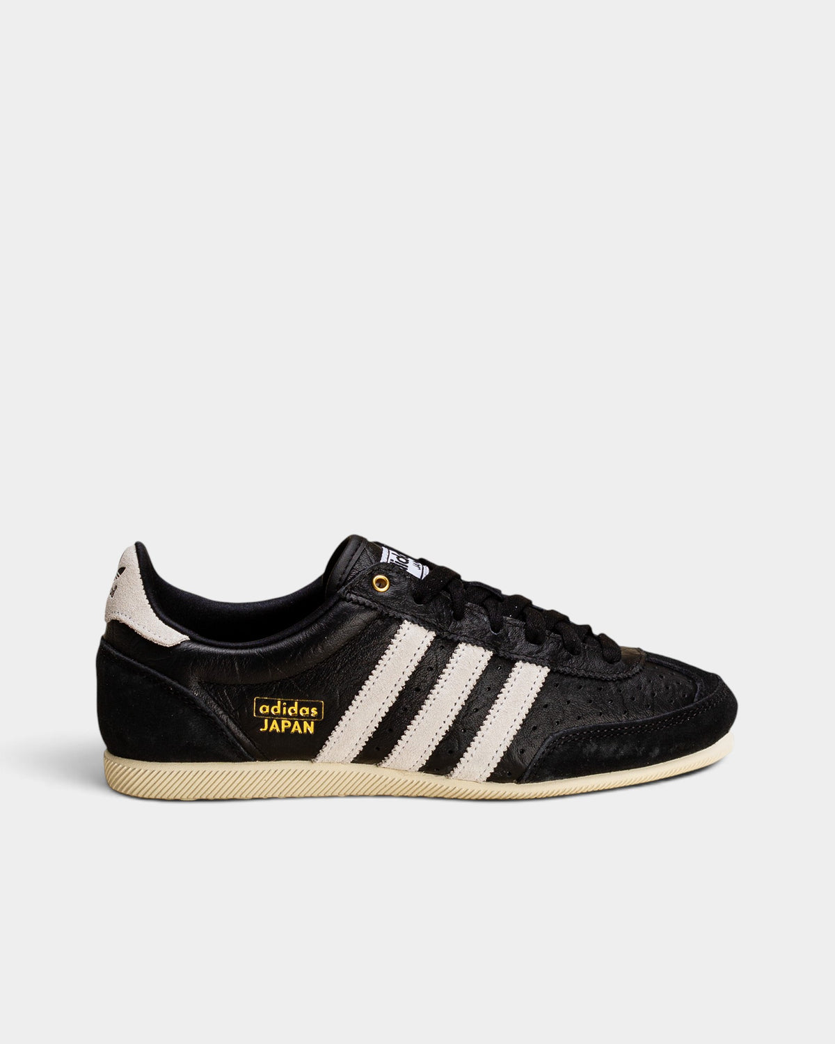 Lockwood Avenue adidas Japan W black perforated leather trainer with white stripes and gold metallic branding