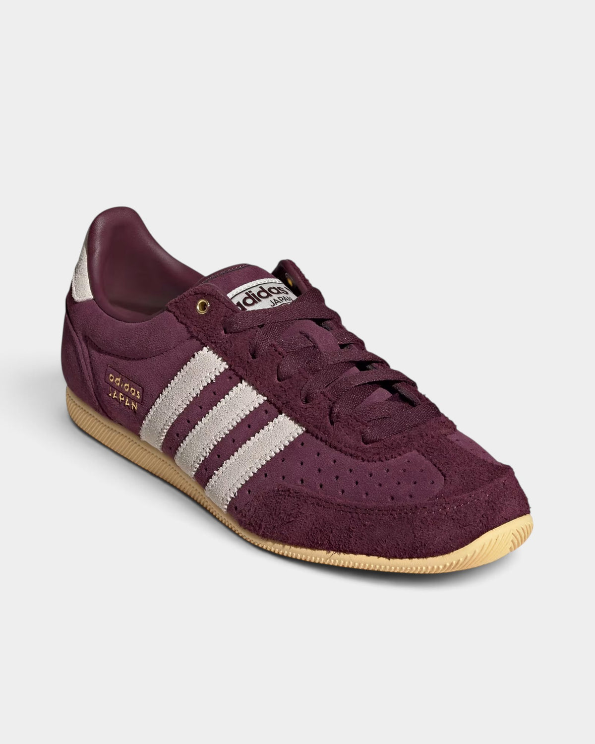 Lockwood Avenue adidas Japan maroon suede sneakers with cream white stripes and gold metallic accents.