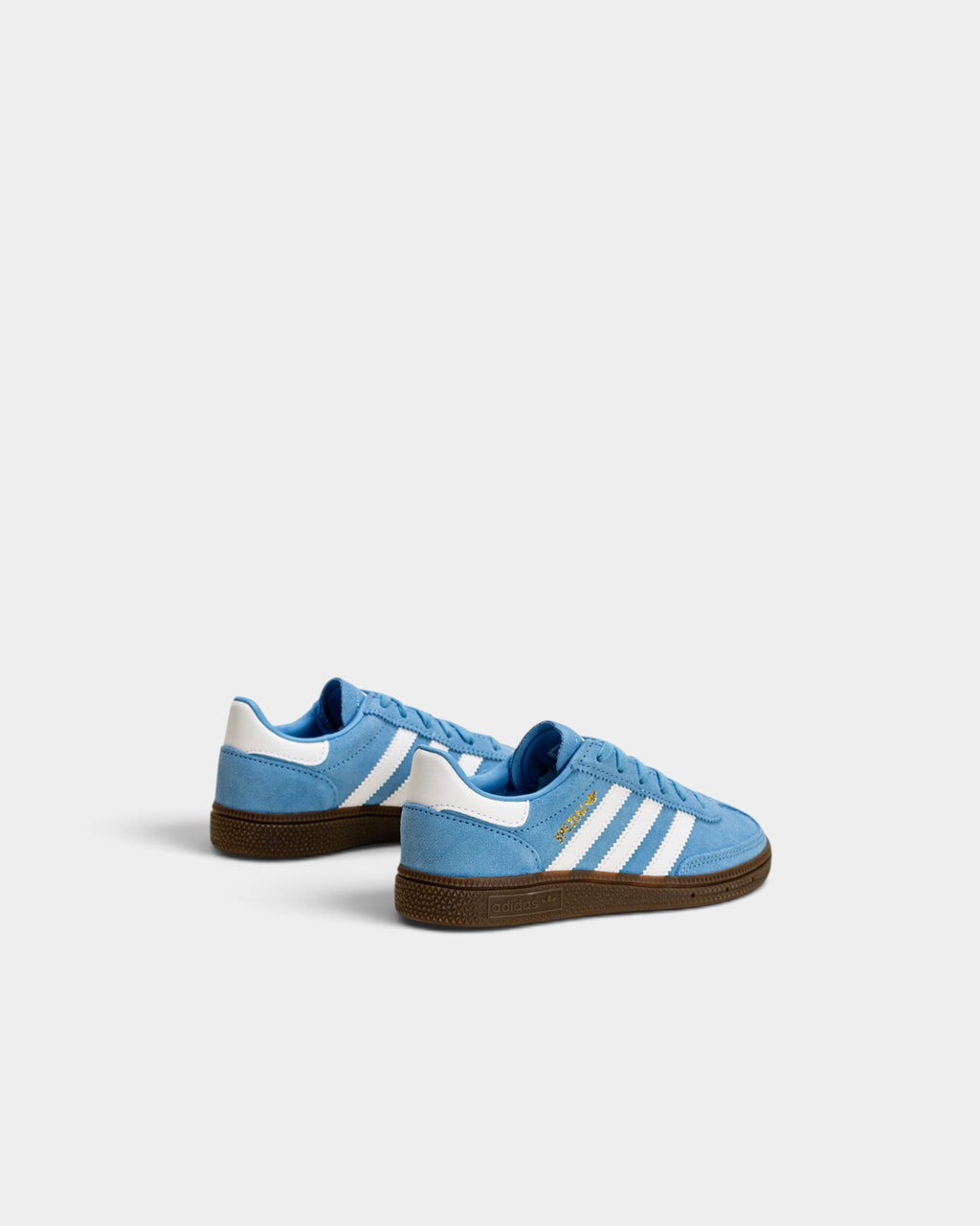 Lockwood Avenue adidas kids light blue suede Handball Spezial sneakers with white stripes and gum rubber soles.