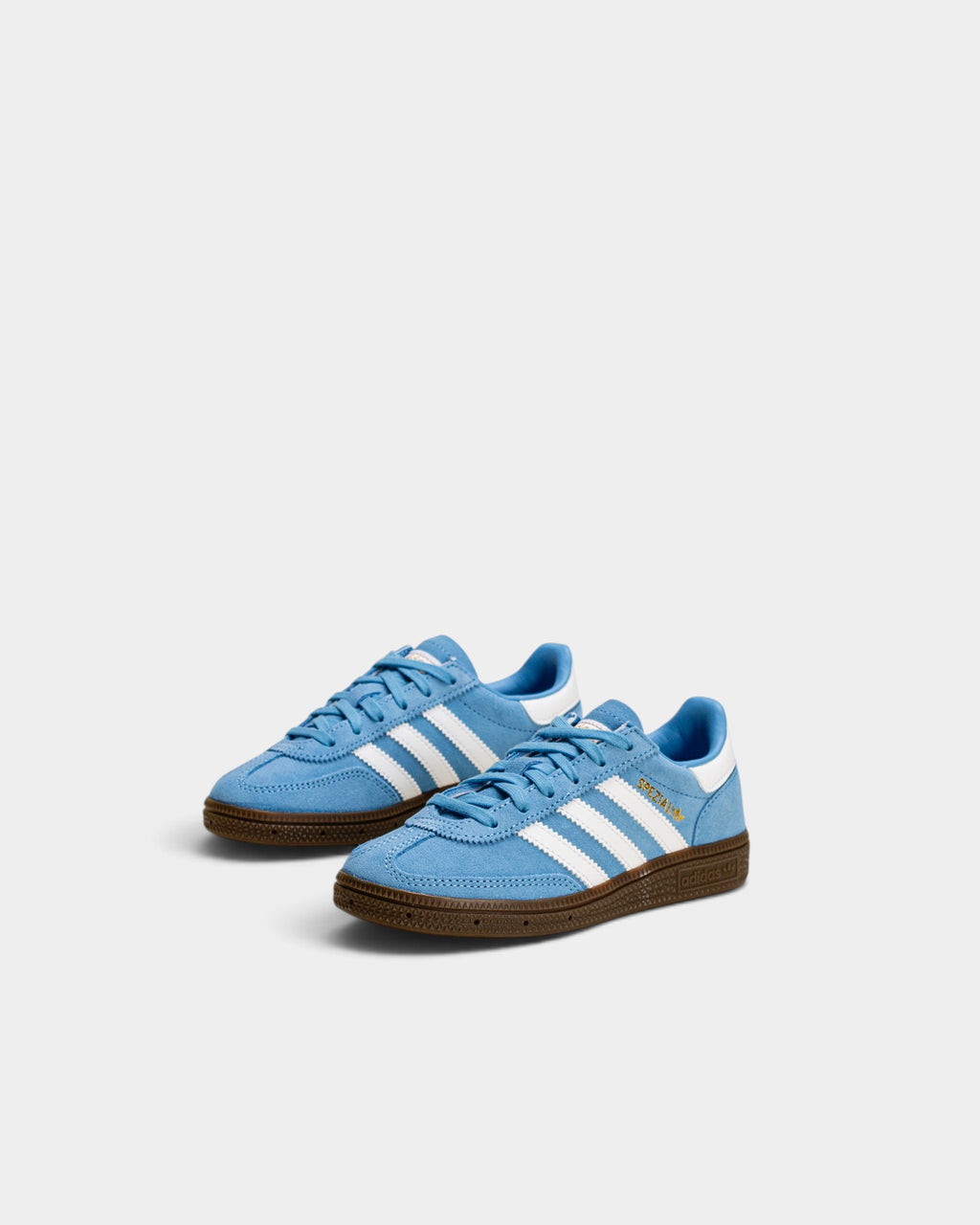 Lockwood Avenue adidas Kids Handball Spezial shoes in light blue suede with white stripes and gum rubber sole.