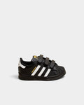 Lockwood Avenue adidas Kids Superstar shoes in black with white stripes, rubber shell toe, and hook-and-loop straps.