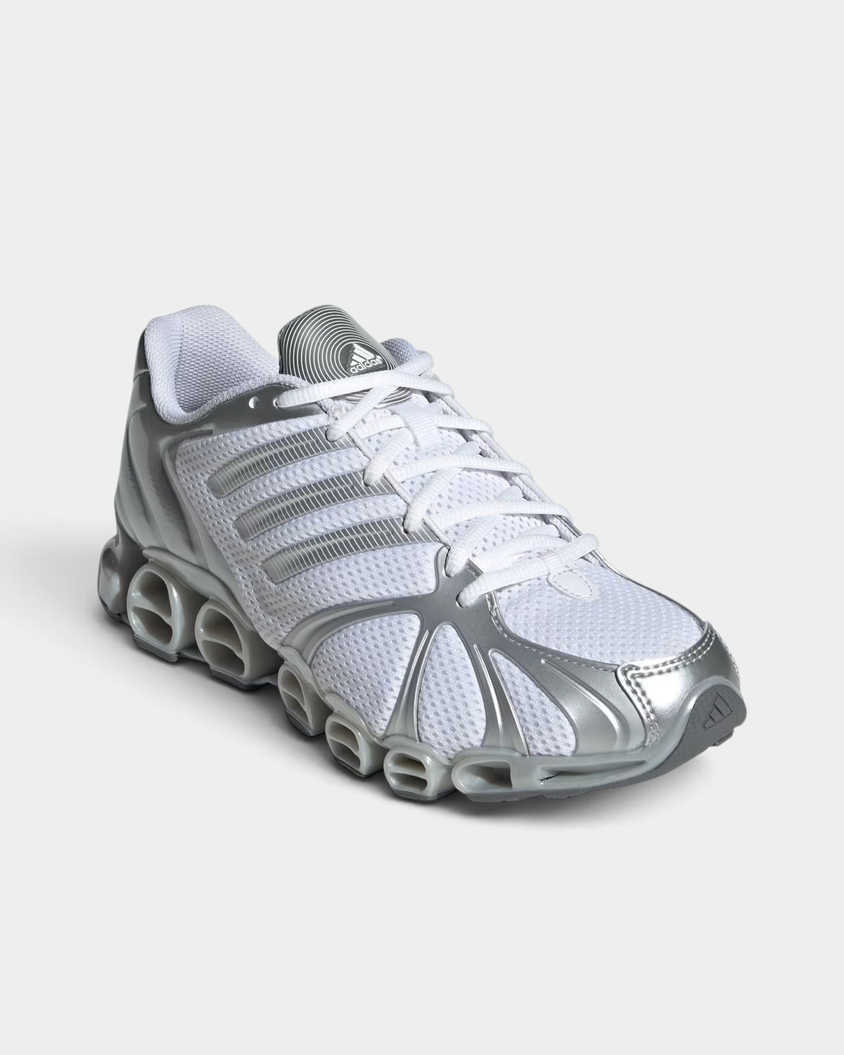 Lockwood Avenue adidas Mega Ghostride women's white and silver metallic mesh sneakers with Y2K style Megaride sole.