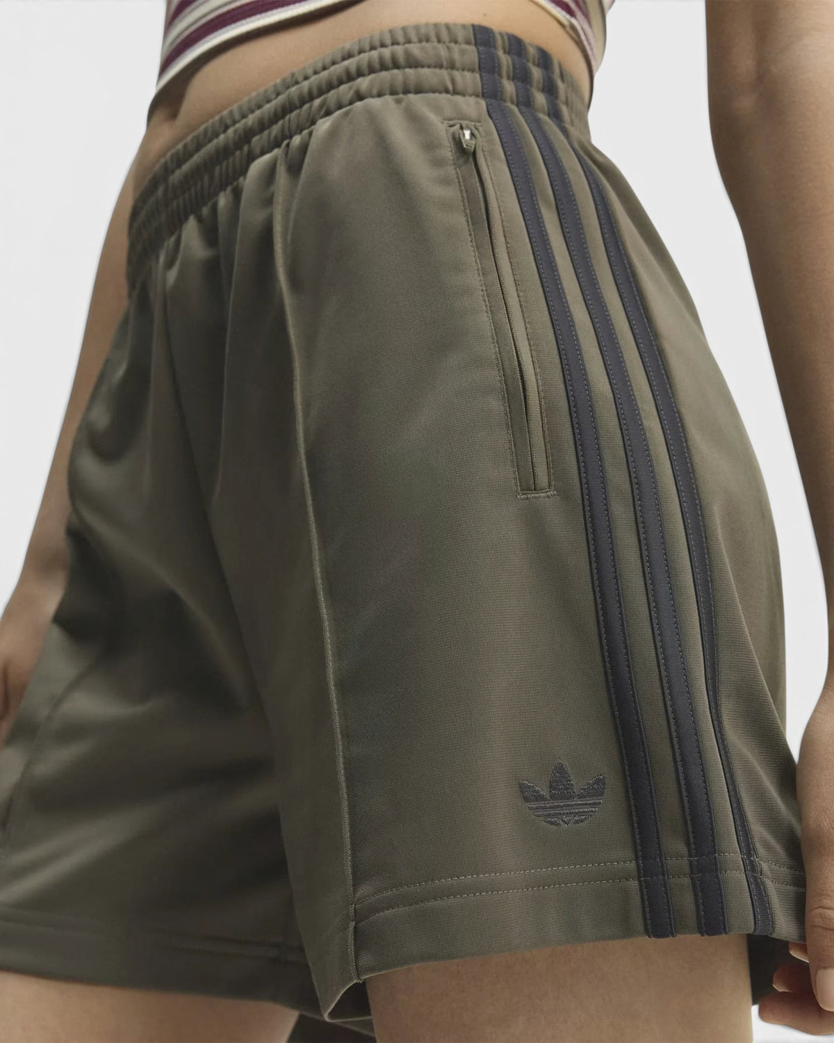 Lockwood Avenue adidas Firebird olive green tricot shorts with side zip pockets and iconic 3-Stripes detail