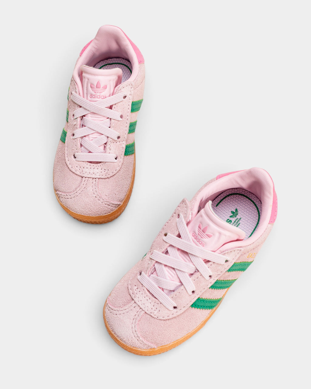 Lockwood Avenue adidas kids Gazelle sneakers in pink suede with green stripes and gum rubber outsoles.