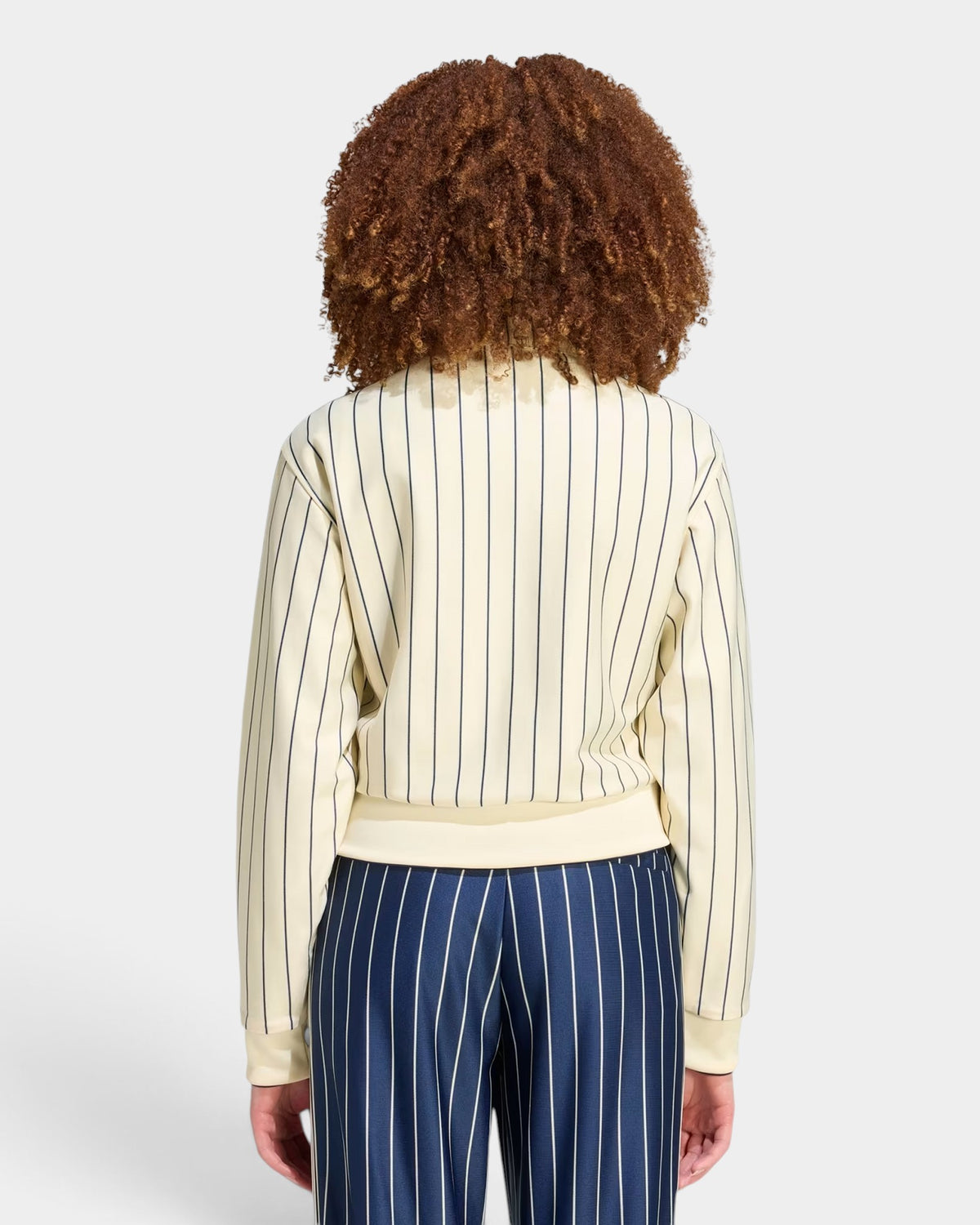 Lockwood Avenue adidas Reversible Firebird Track Top in cream with vertical pinstripes, worn by a model from the back.