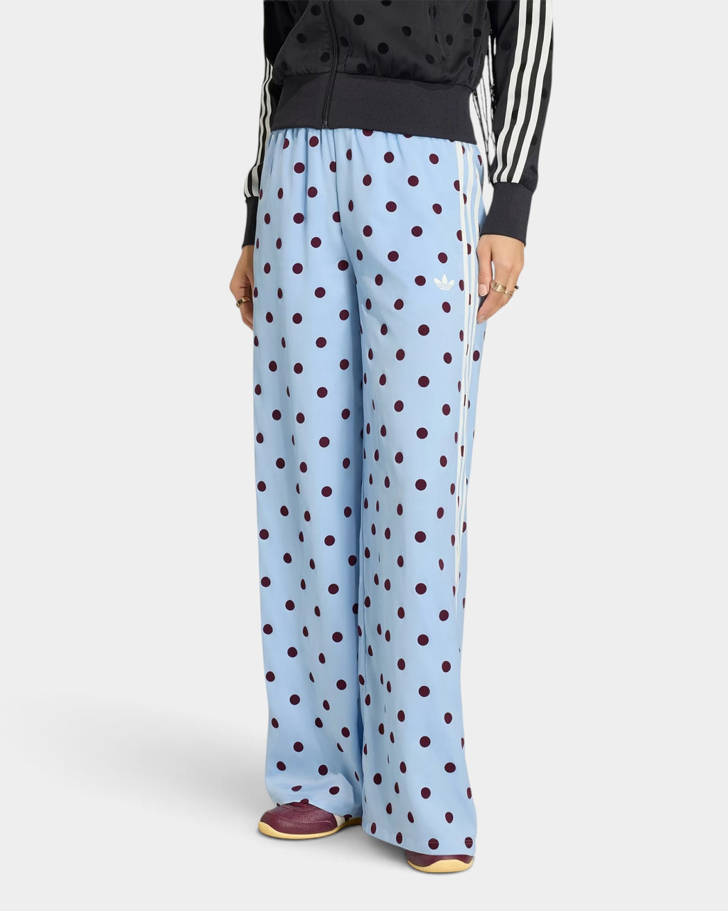 Lockwood Avenue adidas satin wide leg pants in light blue with dark polka dots, drawstring waist, and side stripes.