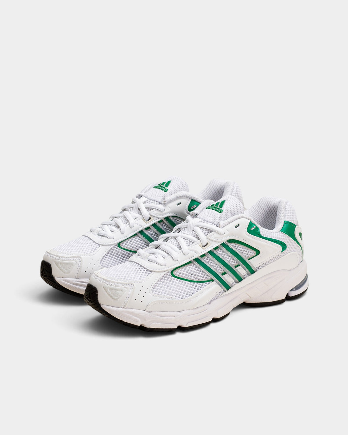 Lockwood Avenue adidas Response CL sneakers in white with green stripes and black accents, 90s style runner design.