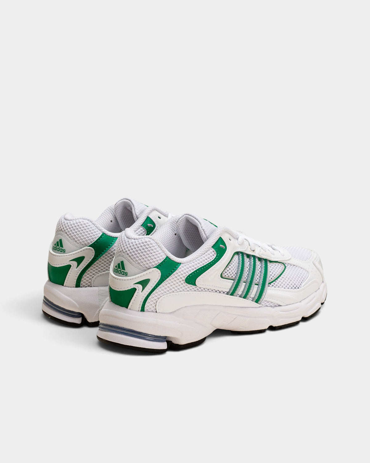 Lockwood Avenue adidas Response CL sneakers in white with green stripes and black accents, rear three-quarter view.