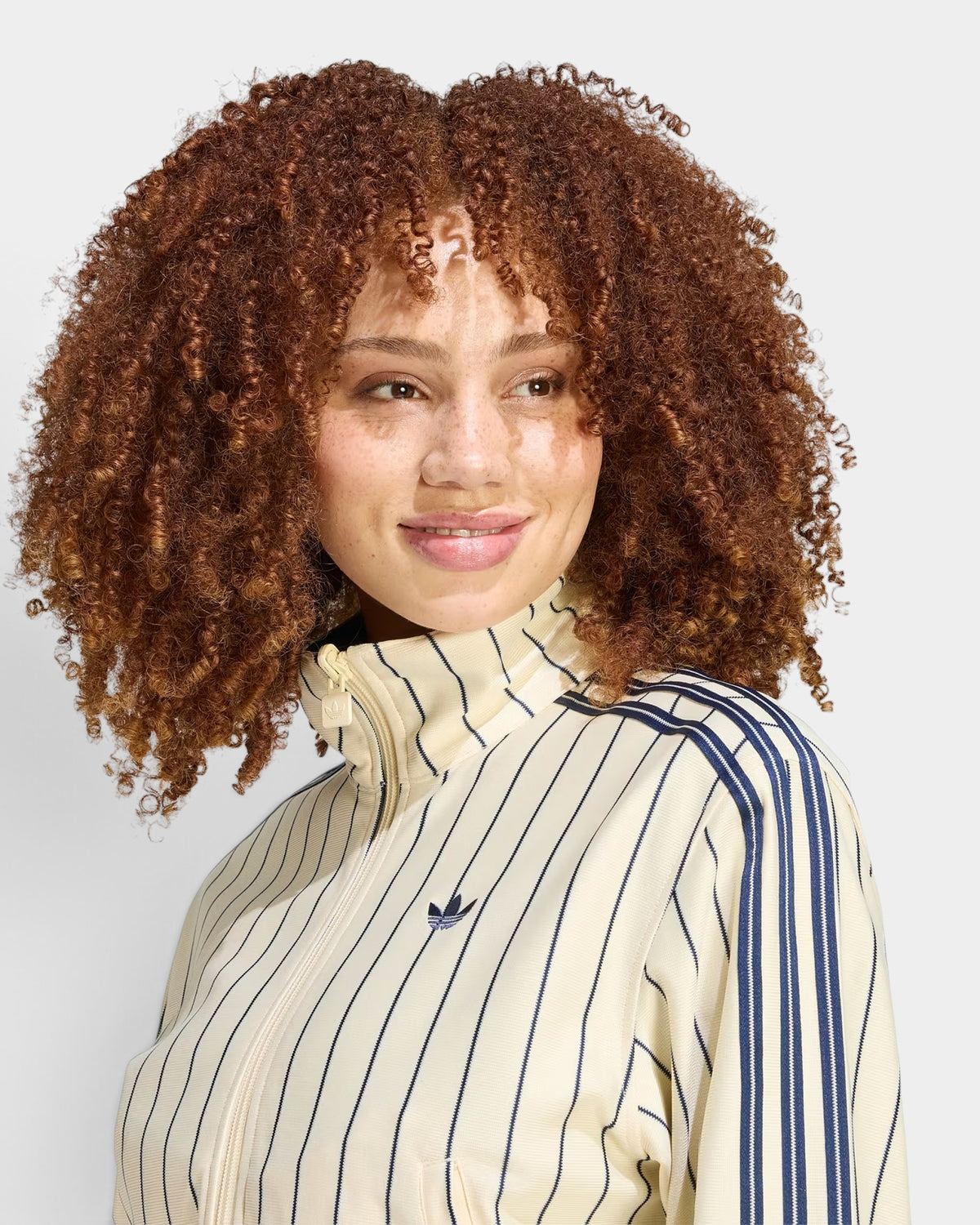 Lockwood Avenue adidas Reversible Firebird Track Top in cream with navy pinstripes and iconic three-stripe sleeves.