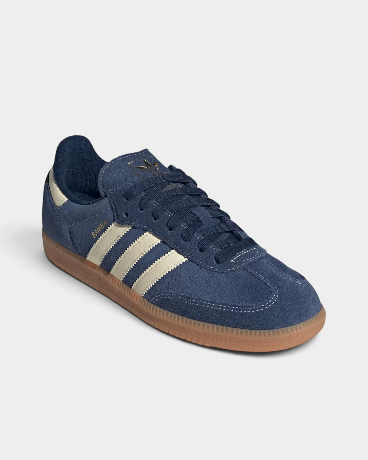 Lockwood Avenue adidas Samba OG sneakers in night indigo suede with warm vanilla stripes and a gum rubber outsole.