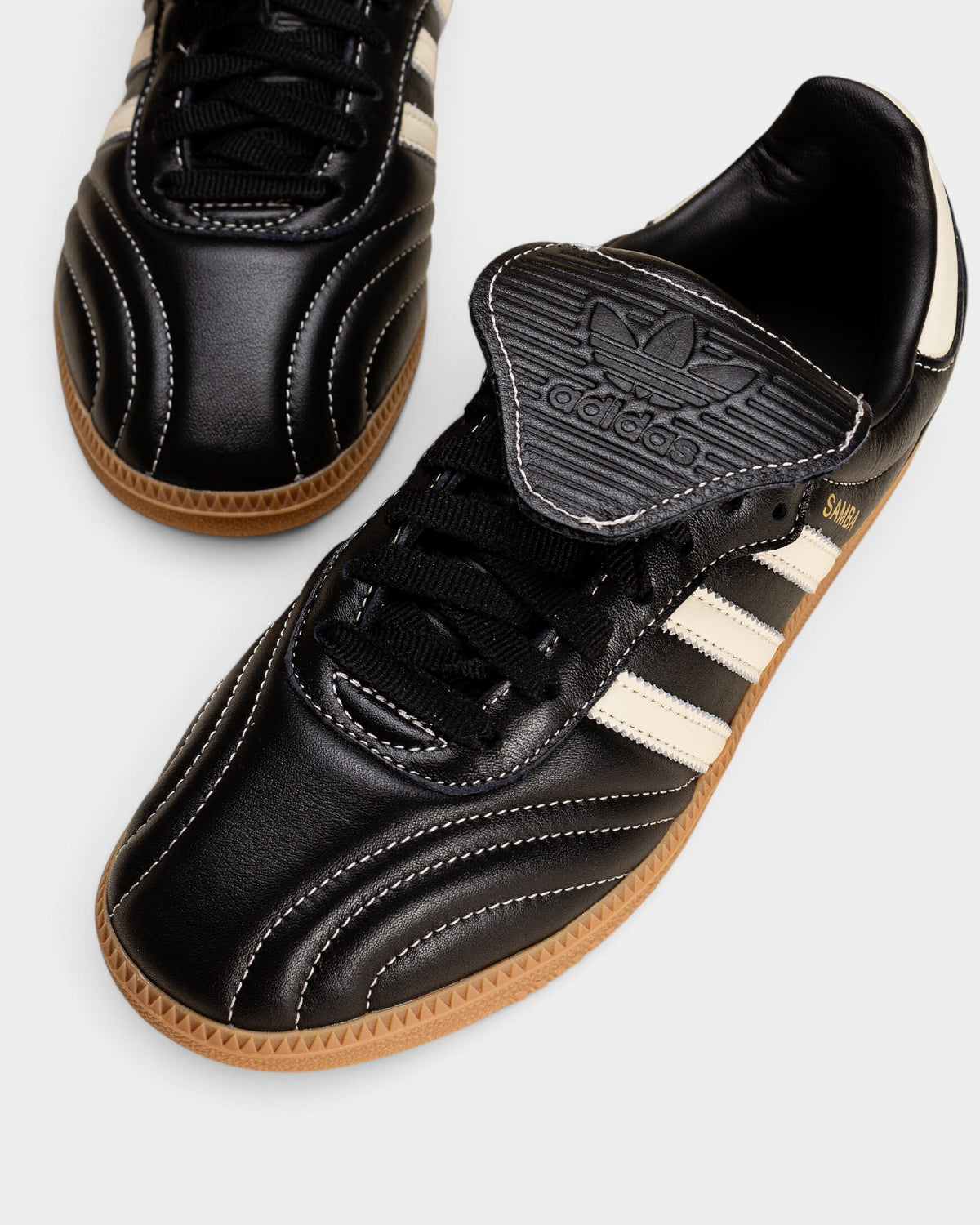 Lockwood Avenue adidas Samba LT W black leather sneakers with quilted toe, long fold-over tongue, and gum sole.