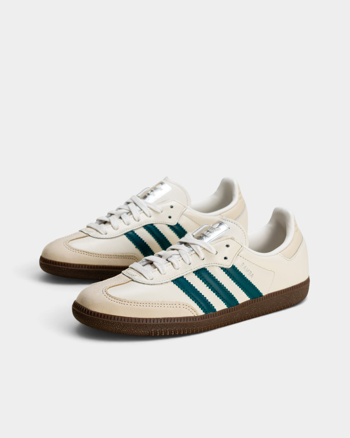 Lockwood Avenue adidas Samba OG sneakers in cloud white leather with legacy teal stripes and gum rubber outsoles.