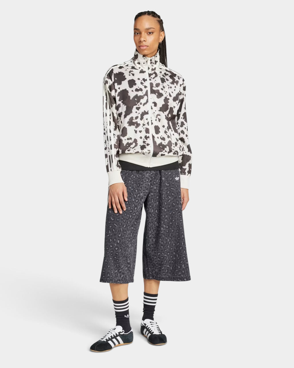 Lockwood Avenue model wearing an adidas satin animal print track top with a stand-up collar and 3-Stripes sleeves.