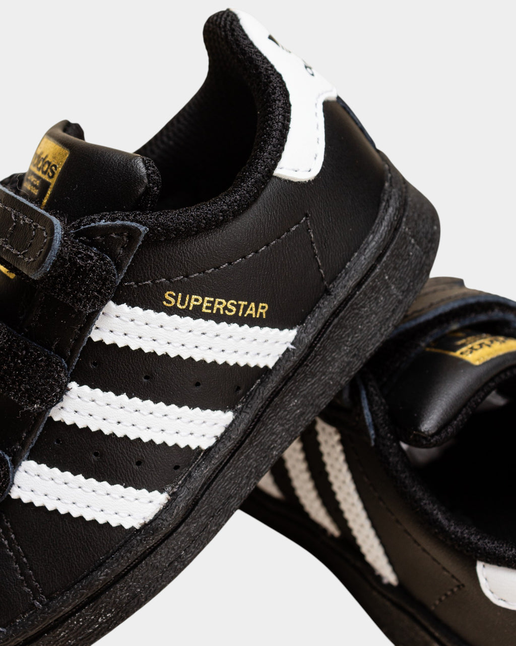Lockwood Avenue adidas Kids Superstar shoes in core black with white stripes and iconic rubber shell toe.