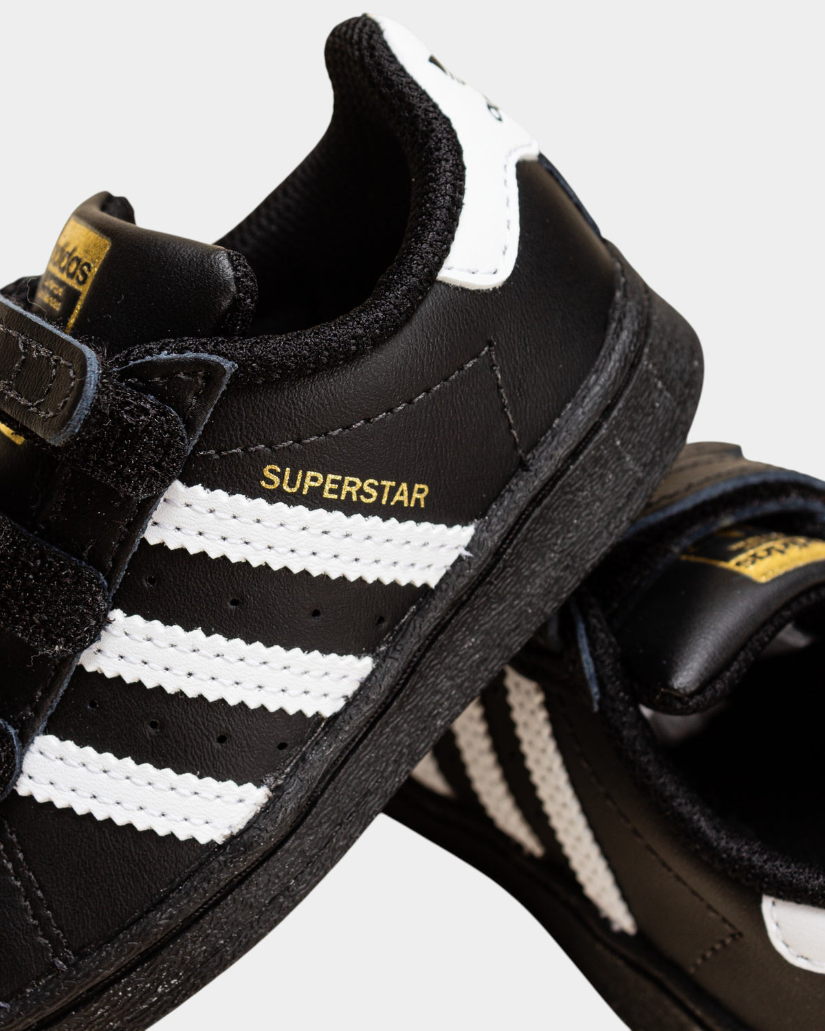 Lockwood Avenue adidas Kids Superstar shoes in core black with white stripes and iconic rubber shell toe.