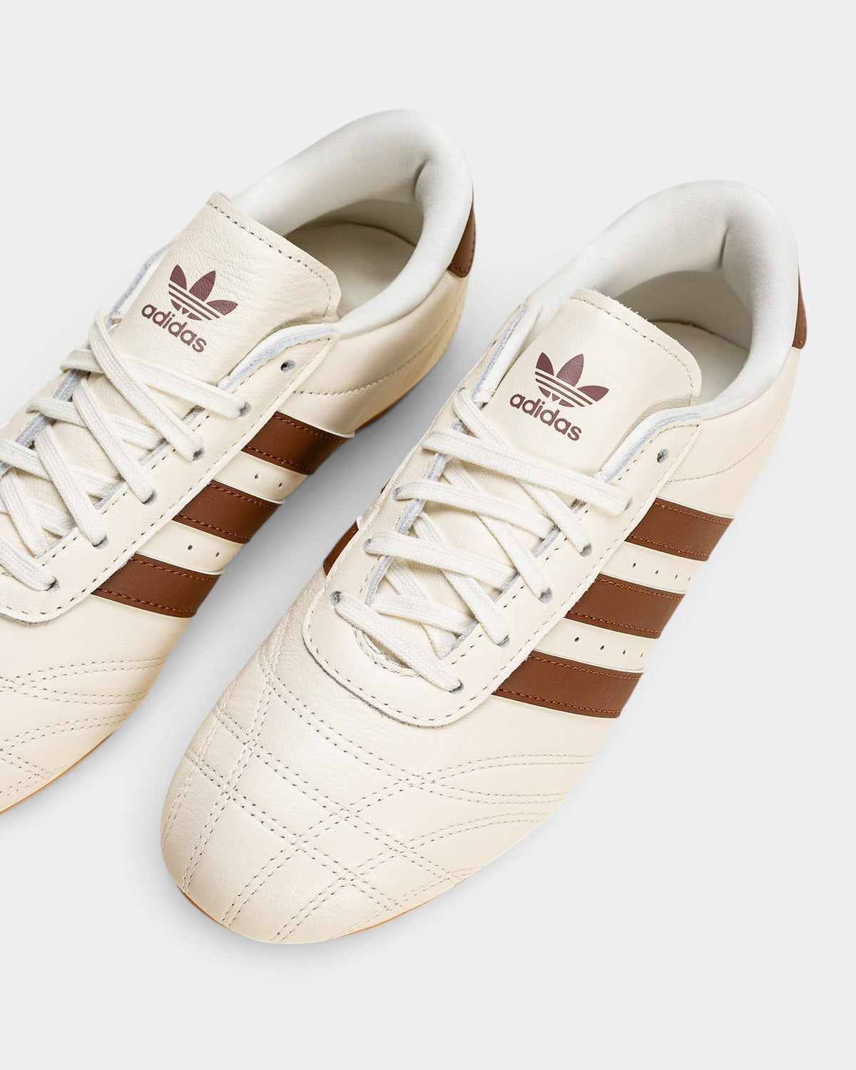 Lockwood Avenue adidas Taekwondo Lace shoes in off-white leather with brown stripes, quilted toe, and gum sole.