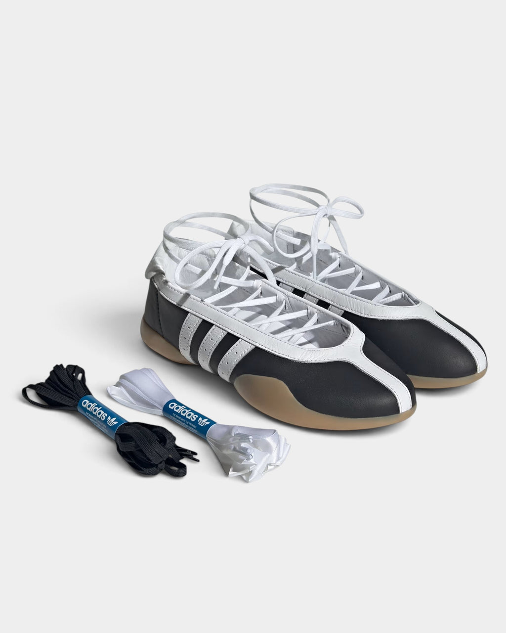 Lockwood Avenue adidas Taekwondo Mei ballet shoes in core black with white stripes, lace-up detail, and gum sole.