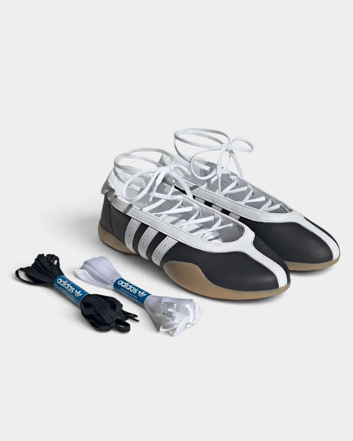 Lockwood Avenue adidas Taekwondo Mei ballet shoes in core black with white stripes, lace-up detail, and gum sole.