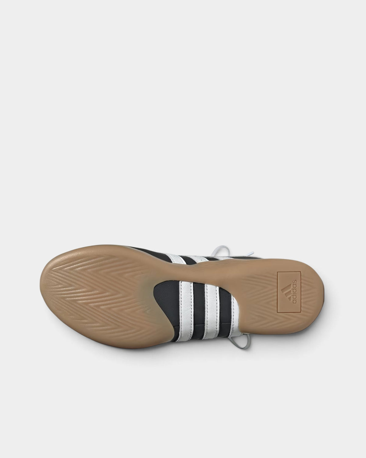 Lockwood Avenue adidas Taekwondo Mei ballet shoe showing the black upper, white 3-Stripes, and textured gum outsole.