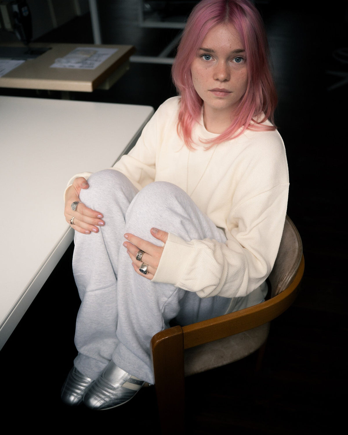 Lockwood Avenue model wearing metallic silver adidas Taekwondo W leather sneakers with a slim, low-profile design.
