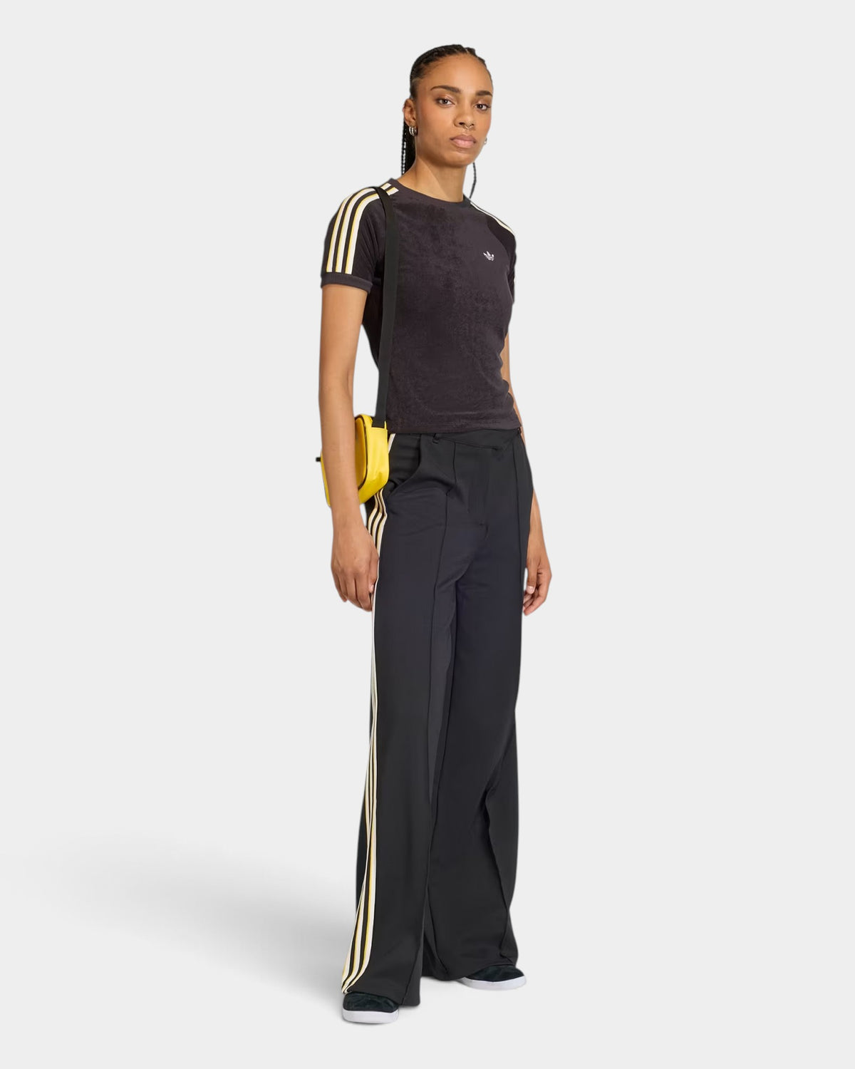 Model wearing a black Lockwood Avenue adidas Terry Towel Cali slim fit t-shirt with white stripes and Trefoil logo.