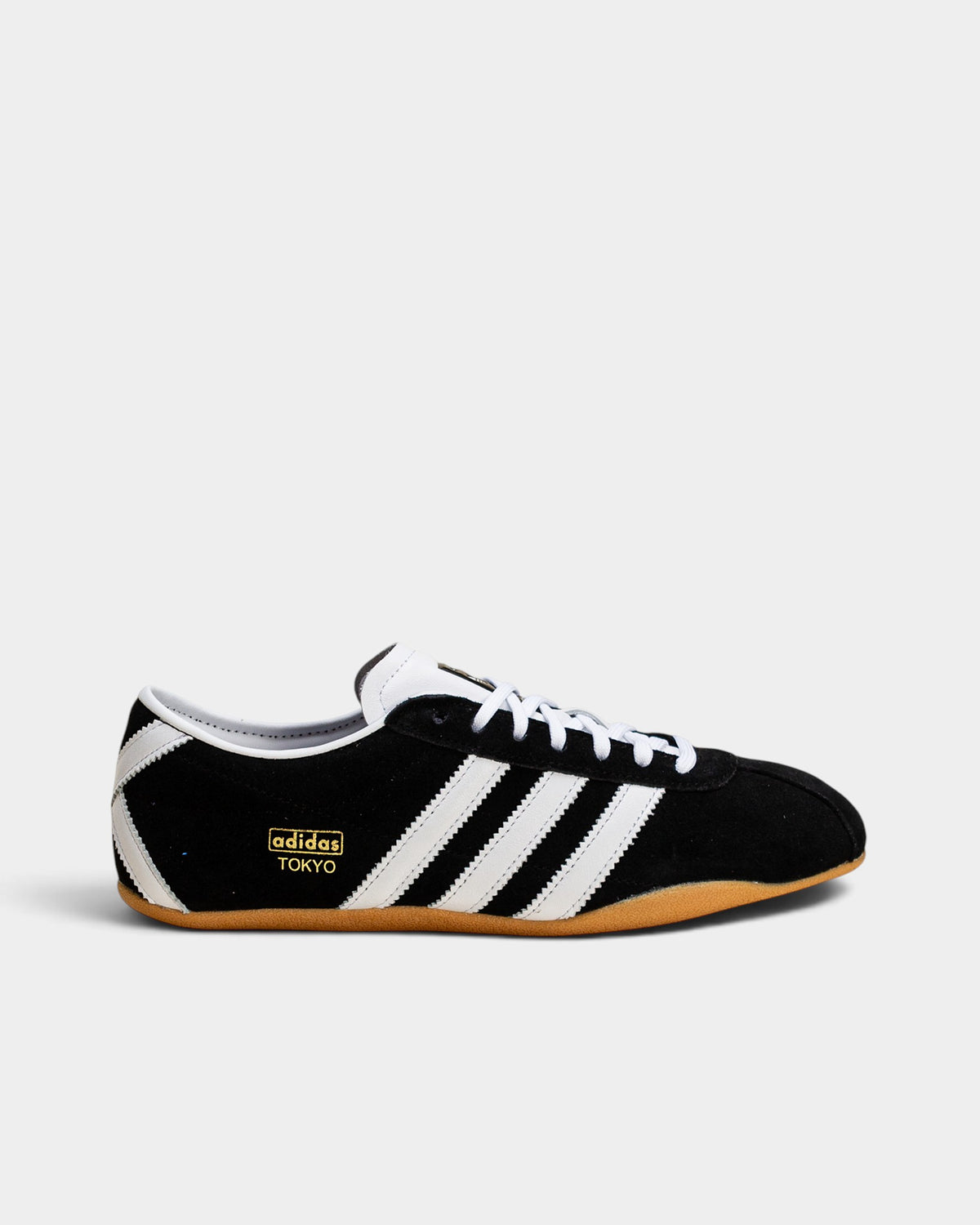 Lockwood Avenue adidas Tokyo women's black suede sneakers with white leather stripes and a gum rubber sole.