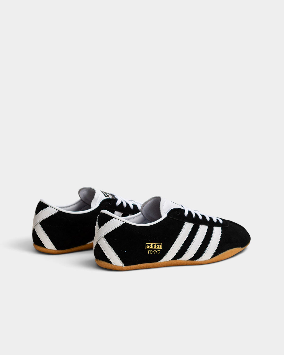 Lockwood Avenue adidas Tokyo W black suede sneakers with white leather stripes and gum rubber sole, rear view