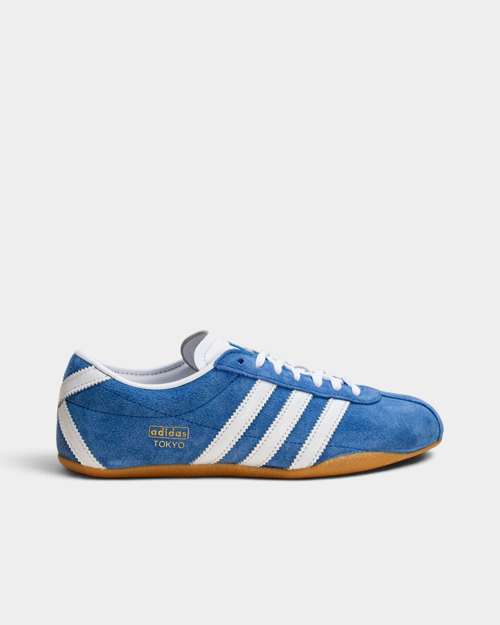 Lockwood Avenue adidas Tokyo blue suede sneakers with white stripes, gold-foil branding, and a gum rubber sole.