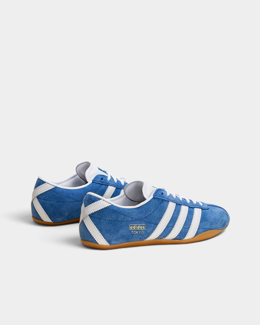 Lockwood Avenue adidas Tokyo sneakers in blue suede with white stripes, gold-foil branding, and a gum rubber sole.